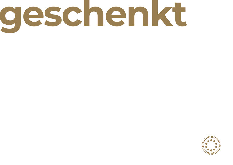 Weiße Karte mit der Aufschrift "geschenkt"